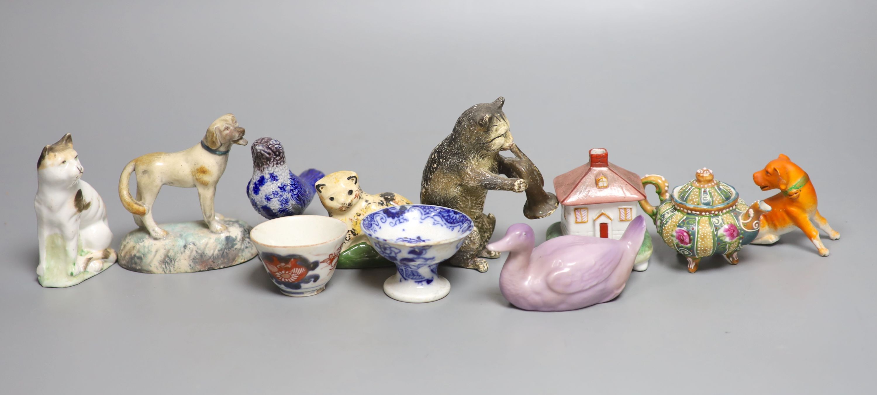 A quantity of miniature ceramic pots, figurines, animal ornaments etc